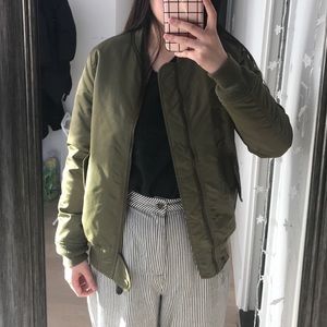 Olive green bomber jacket.